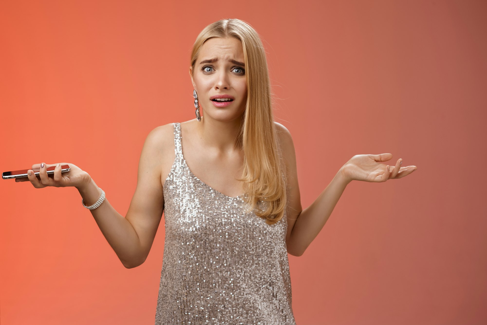 Frustrated upset dumped blond attractive girlfriend shrugging hands sideways dismay look questioned