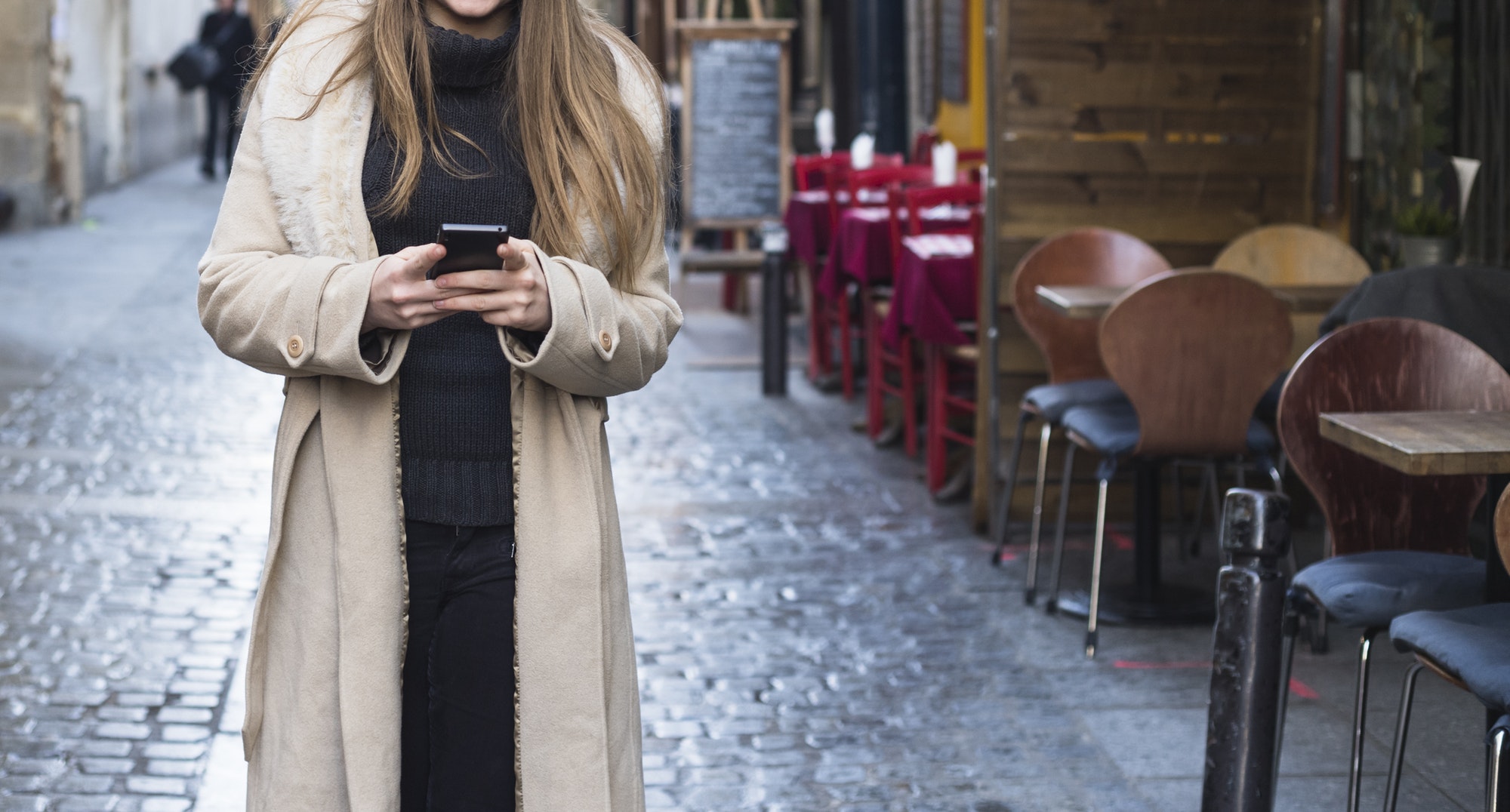 woman using phone in the street
