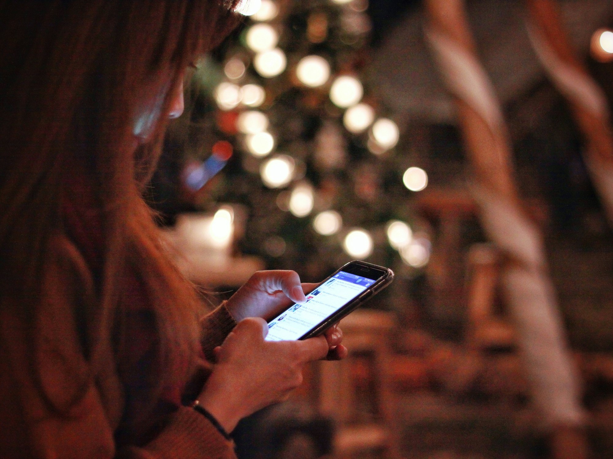 Women using laptop smartphone in the night